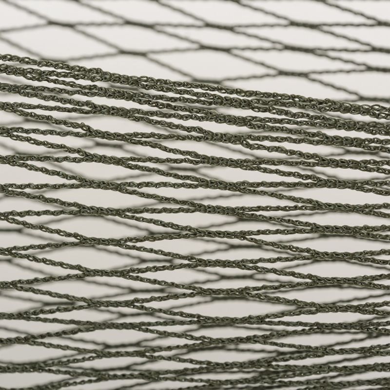 green coloured net showing weave of hammock